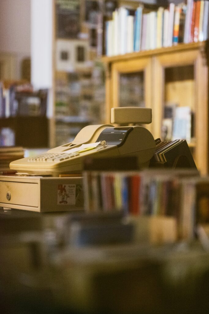 Old cash register in a bookstore representing secondhand gospel and inherited religion